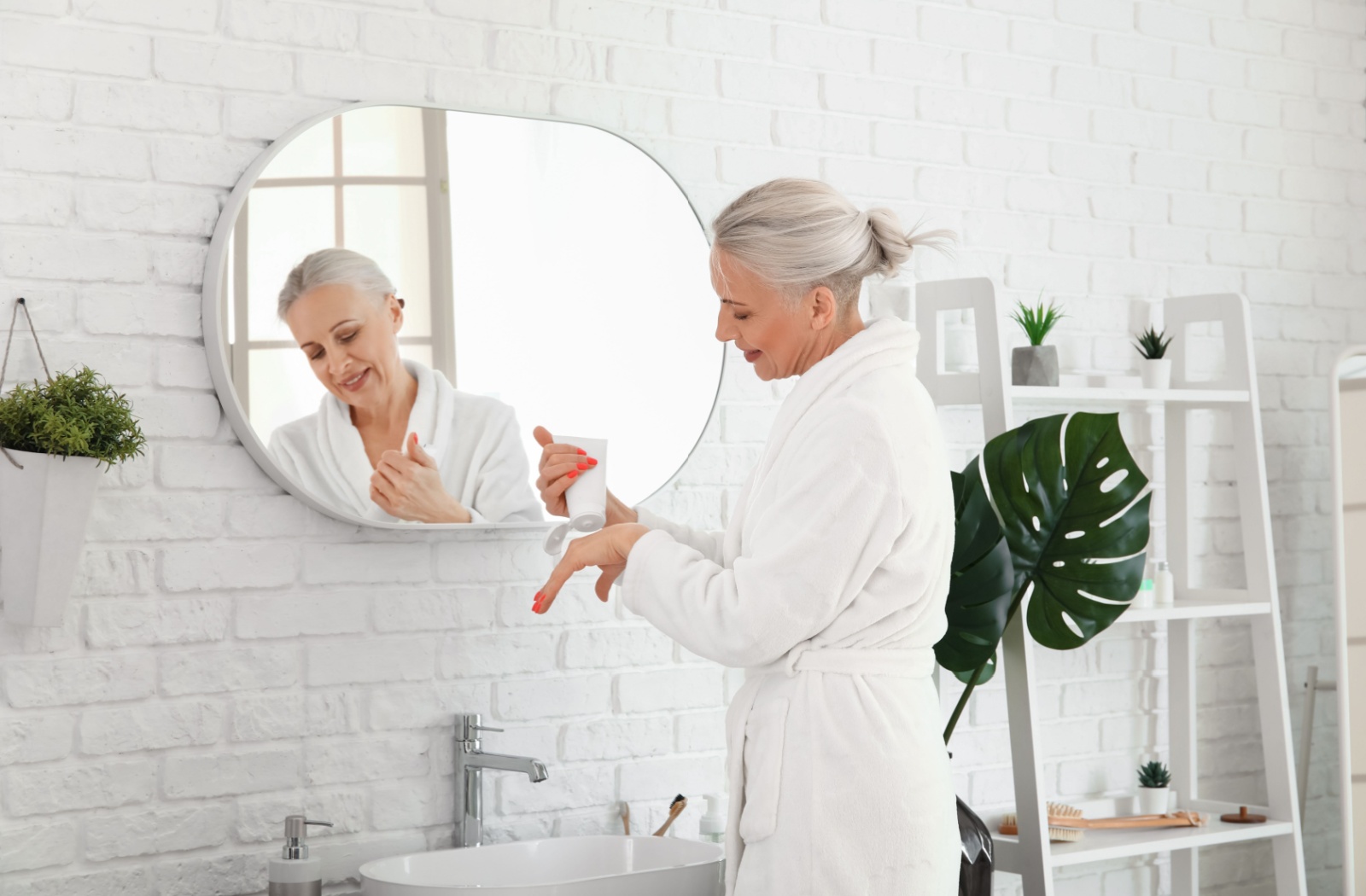 A mature woman in the early stages of dementia prepares for her shower.